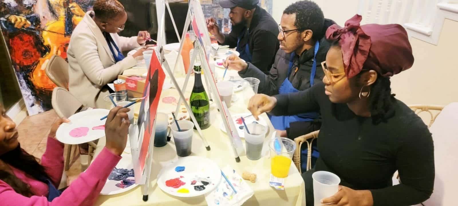A group of people enjoying a paint and sip session in DC.