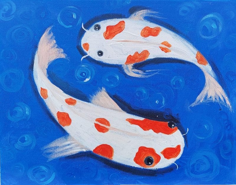A painting of two koi fish on a blue background created during a paint and sip session.