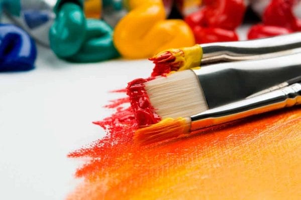 An image of a paintbrush and paint on a white background, perfect for paint and sip in DC or Washington DC events.